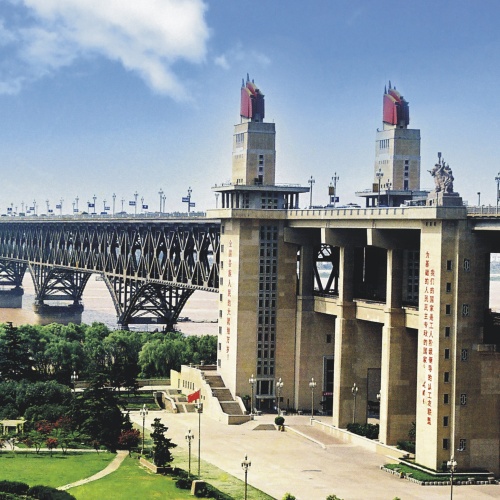 View of the double-decked road-rail truss bridge, with nine piers spanning the Yangtze river in China.