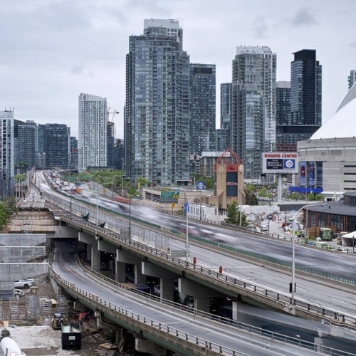 Underneath the elevated section of the Gardiner Expressway, Vector employees work to restore the crumbling columns and beams.